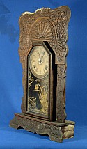 Before using Wood Elixir, this clock suffered from mold & mildew, paint smears, water damage, dried-out finish, and appeared dull and dirty